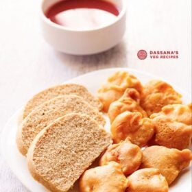 aloo pakora arranged on a plate with slices of wheat bread on a square plate with text layovers