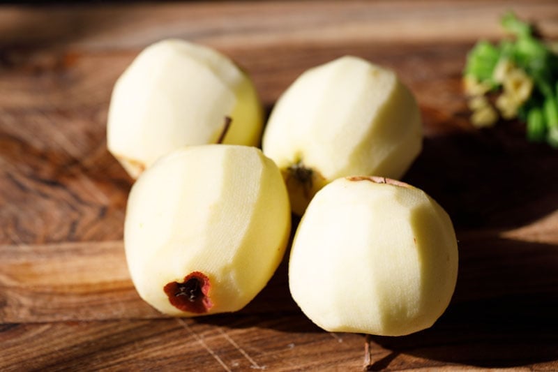 four peeled apples