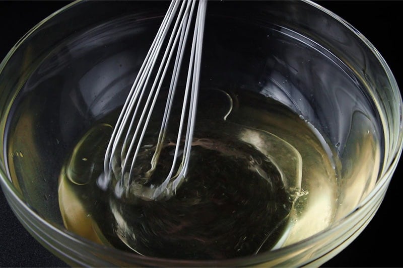 whisking the oil in the cold water
