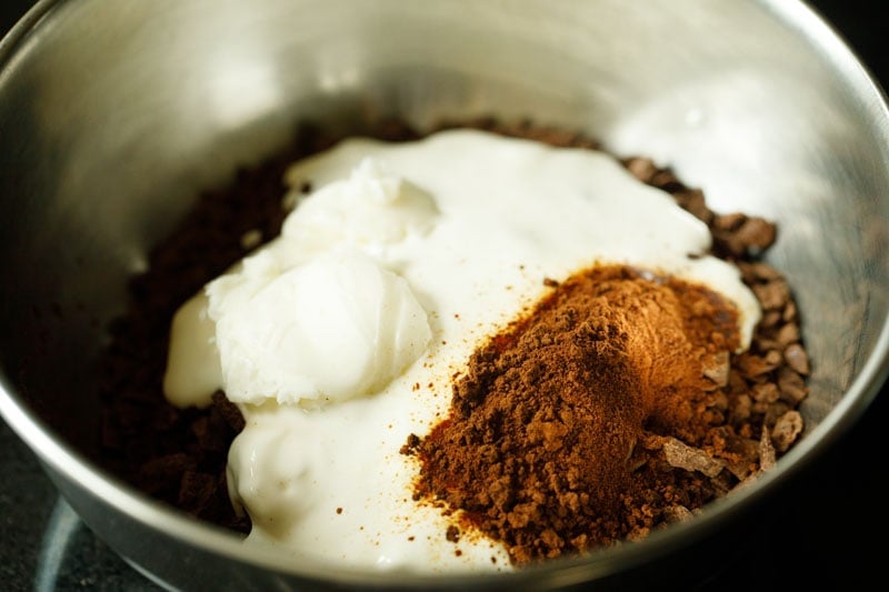 cream, instant coffee, butter and pinch of salt in the bowl with chocolate