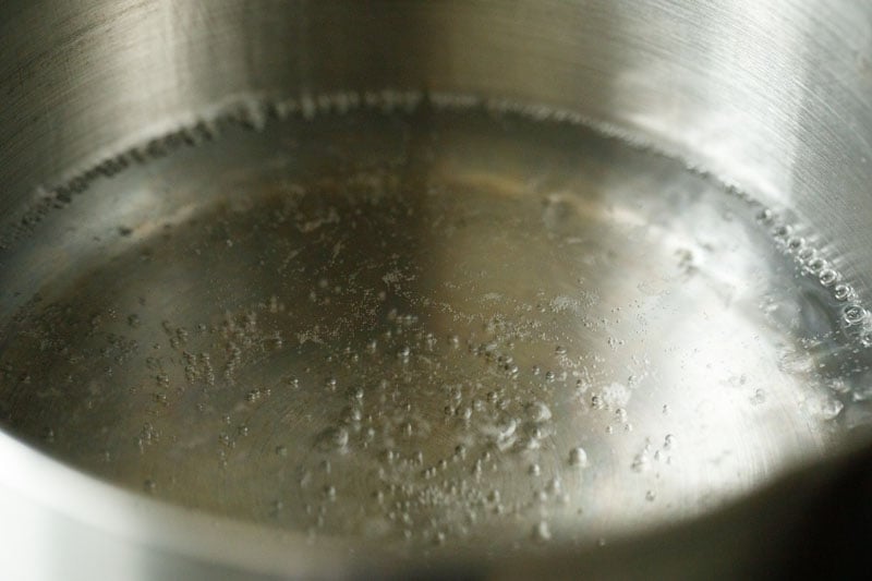 water boiling lightly in a pan