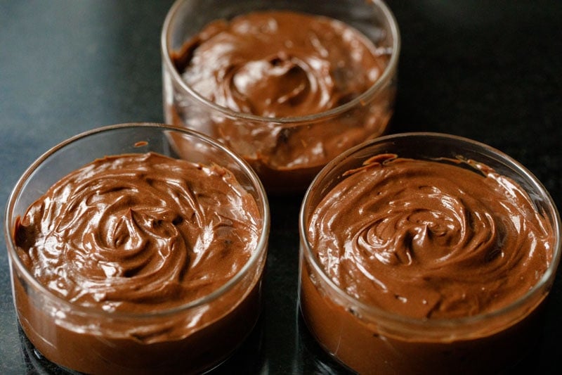 chocolate mousse in three glass bowls