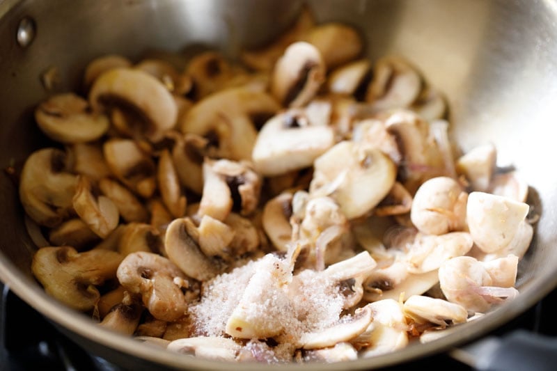 salt and mushrooms added to pan