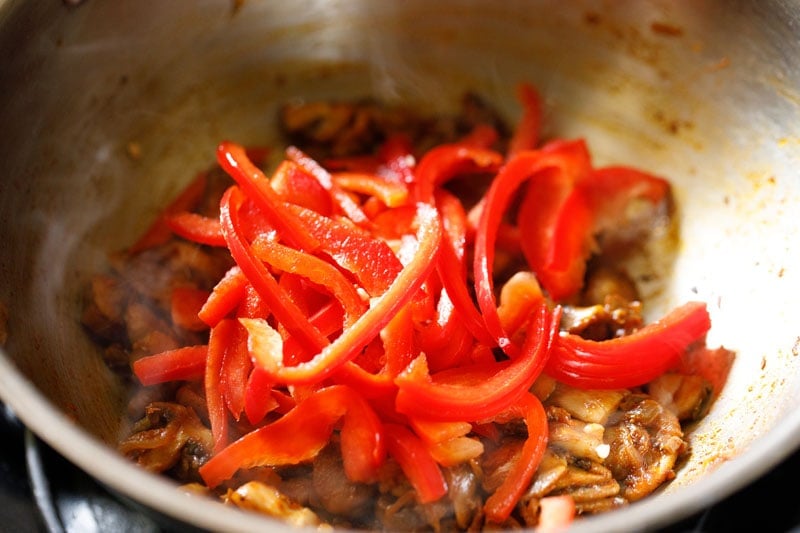 sliced red bell pepper added to pan