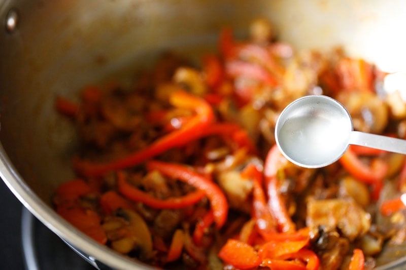 teaspoon of lemon juice over pan with veggies