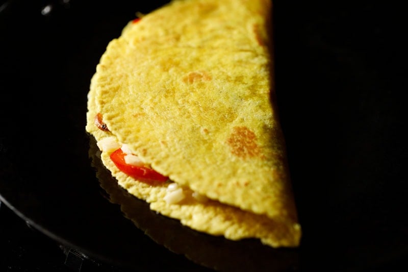 quesadilla folded in half to pan fry