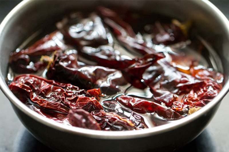 dry kashmiri chillies soaking in hot water