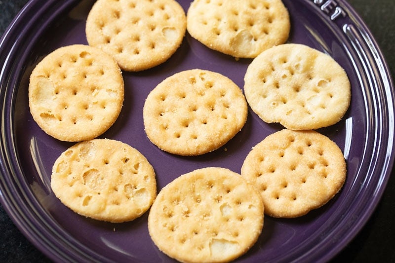 puri for sevpuri arranged on a purple ceramic plate