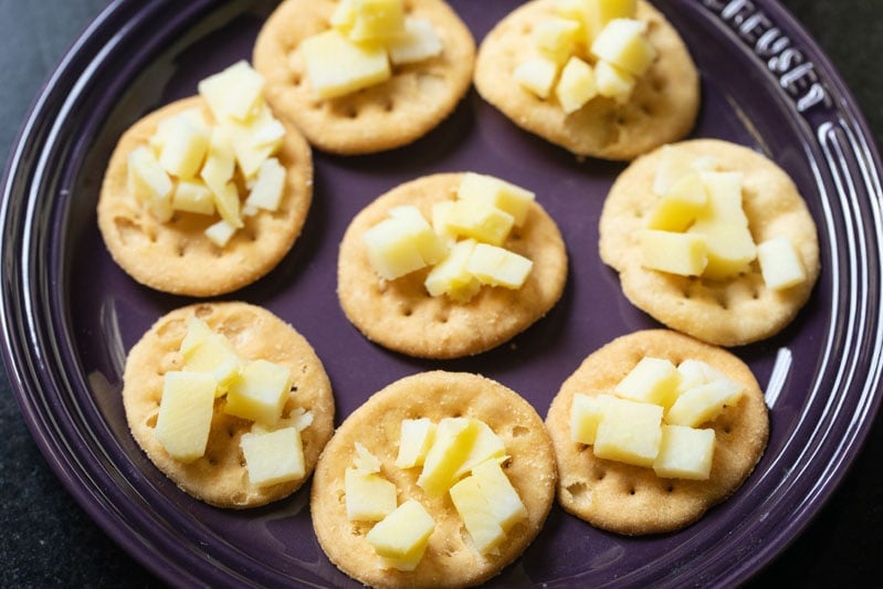 chopped boiled potatoes topped on puri