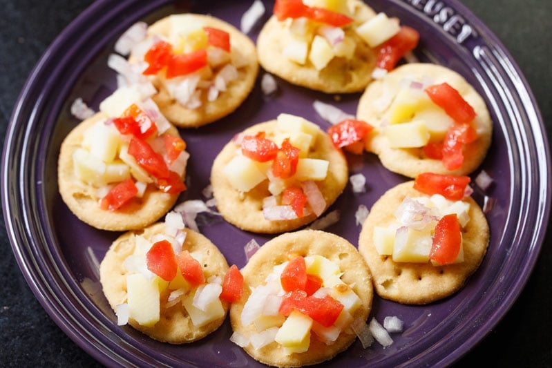 chopped onions and tomatoes on the puri