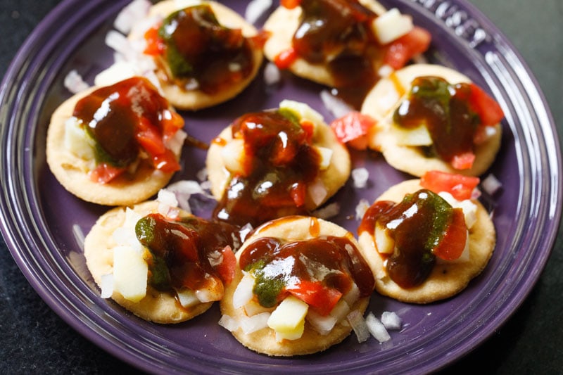 tamarind chutney topped on the puris