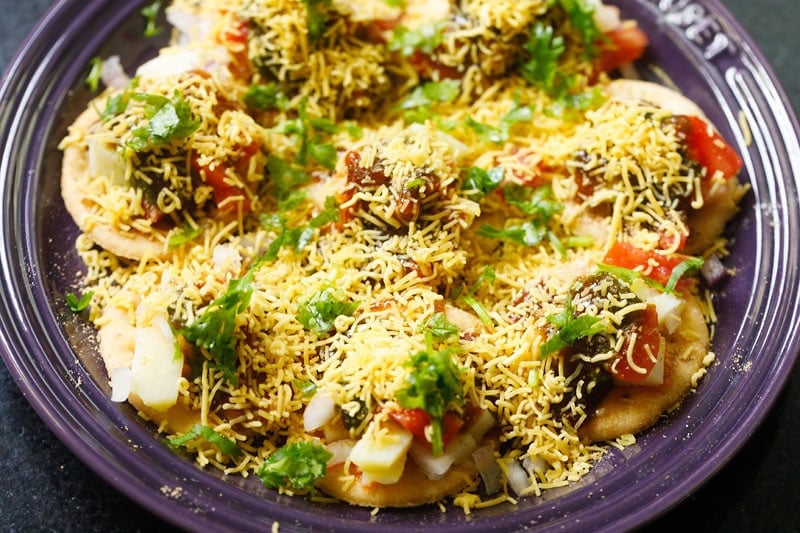 sev puri garnished with chopped coriander leaves
