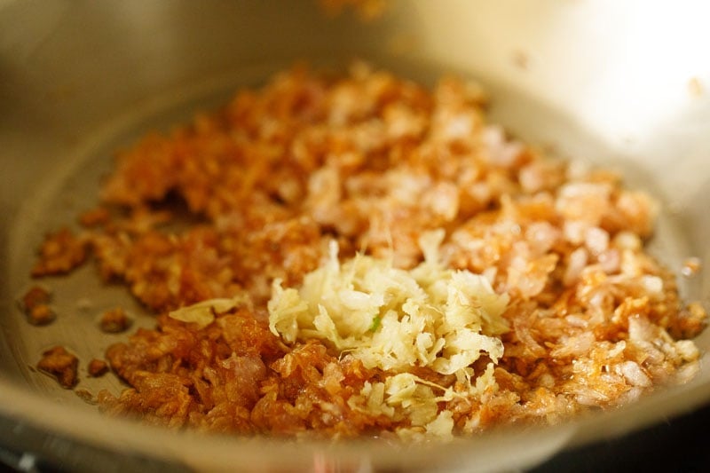 ginger garlic paste added to pan with caramelized onions