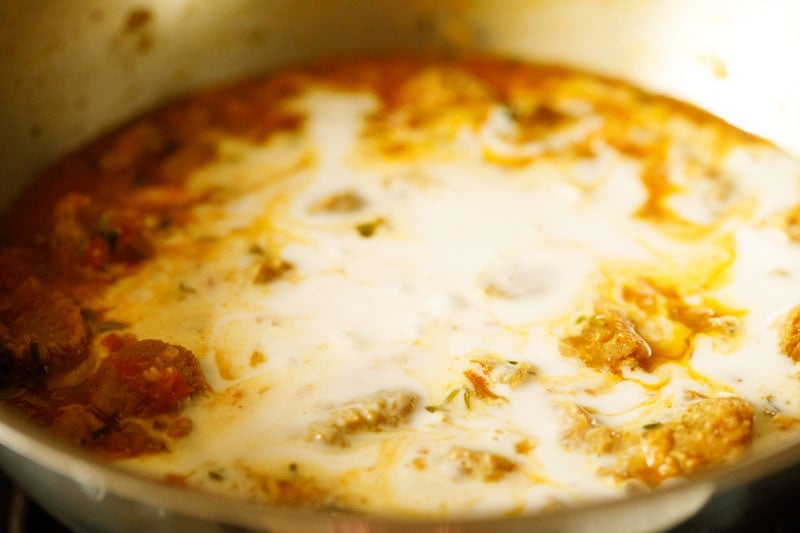 coconut milk poured into the gravy