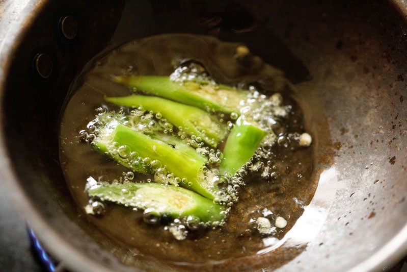 chiles cooking in wok