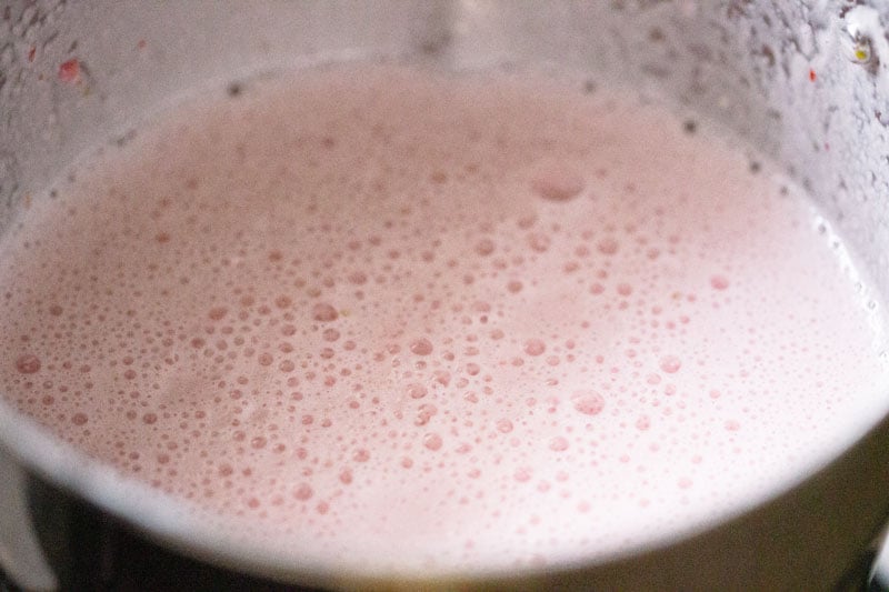making strawberry milkshake