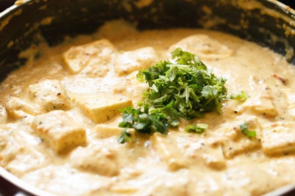 fresh mint and coriander leaves added to achari paneer gravy