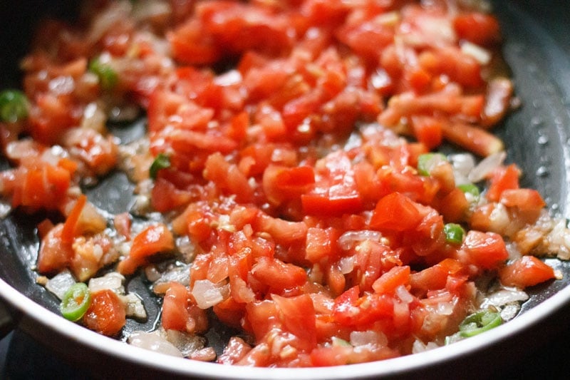 chopped tomatoes in the pan