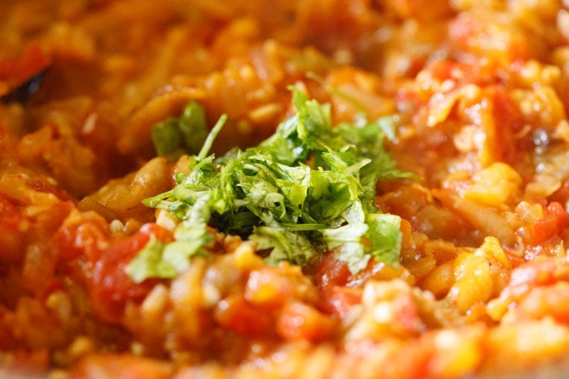 chopped coriander leaves on baingan bharta