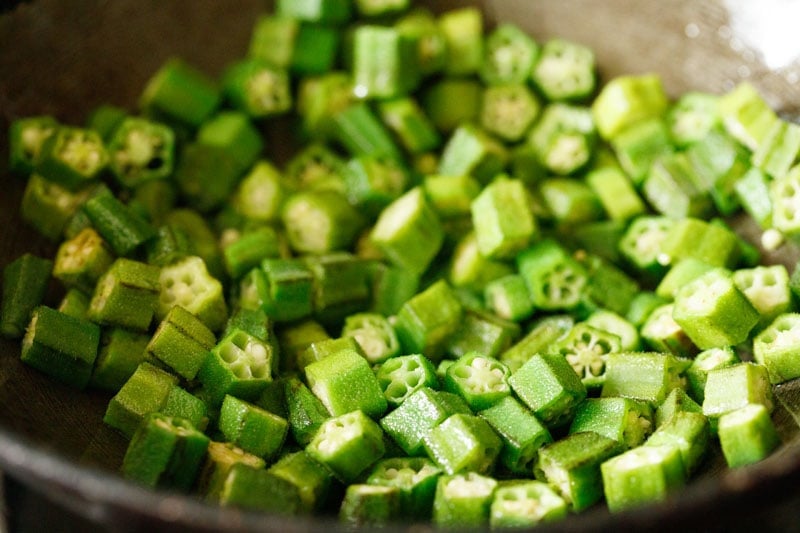 okra or bhindi mixed with oil in pan