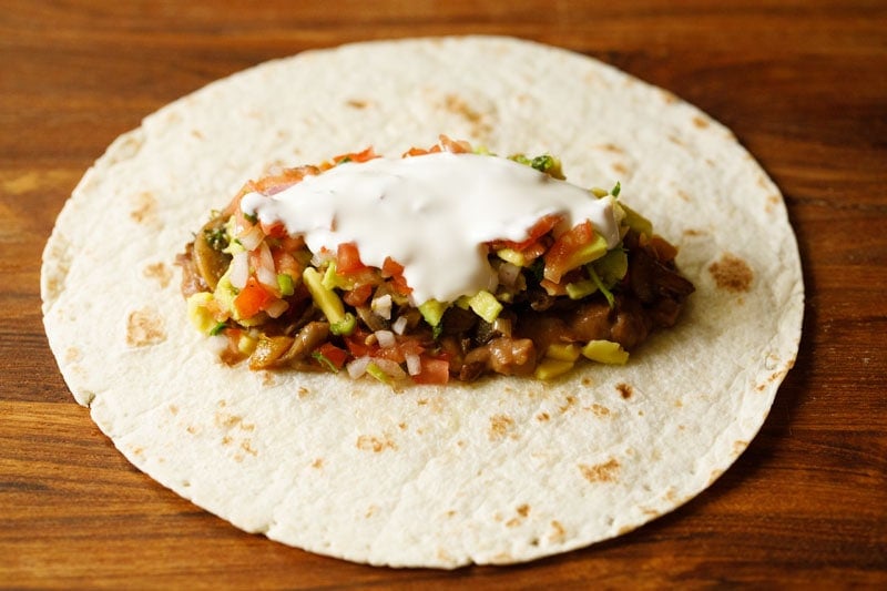 sour cream as the final vegetarian burrito filling