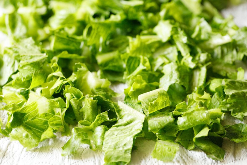 rinsed lettuce scattered on paper towels to finish drying