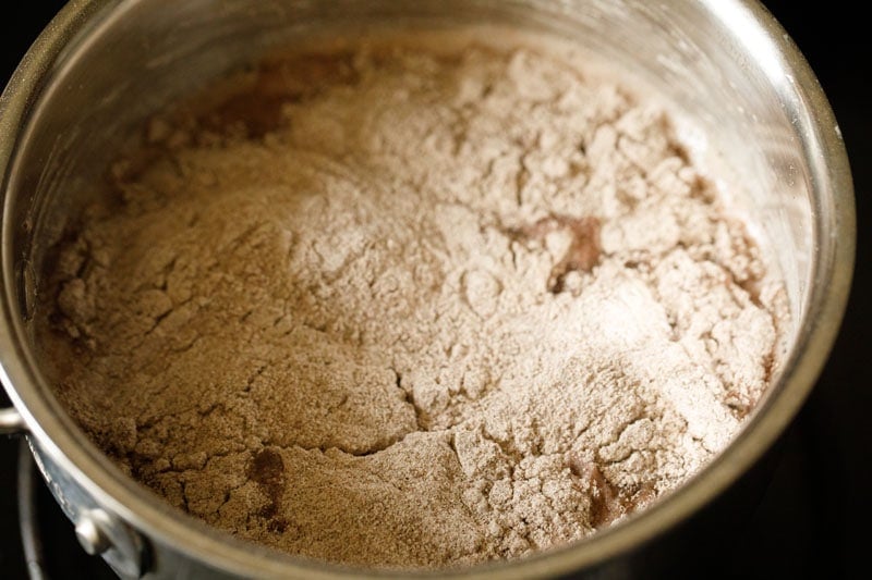 close up shot showing even distribution of flour over pan