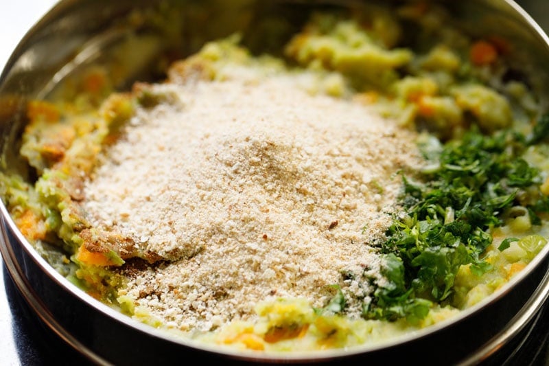 mound of bread crumbs on the spices, seasonings on the mashed veggies