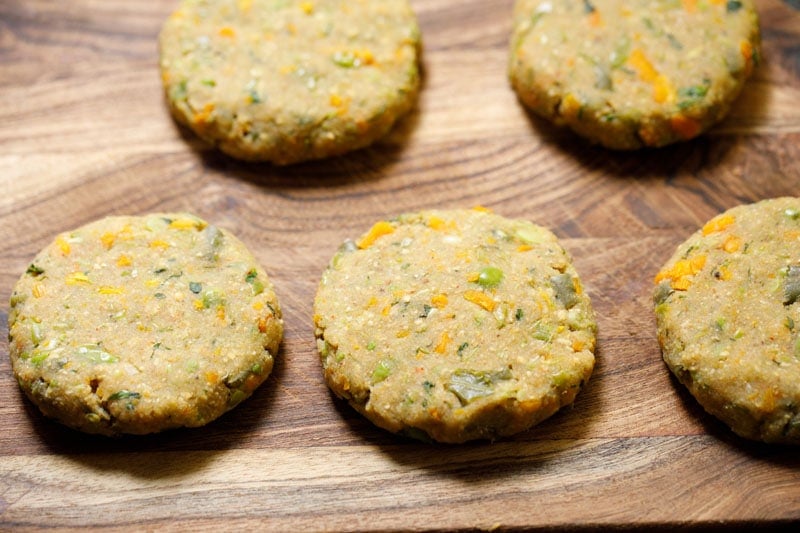 shaped veggie patties on wooden board