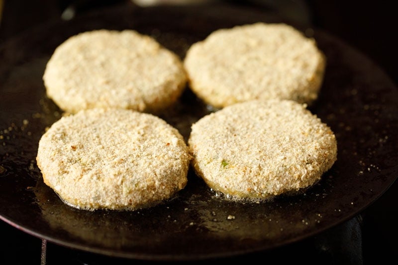 four veg cutlet placed on a skillet