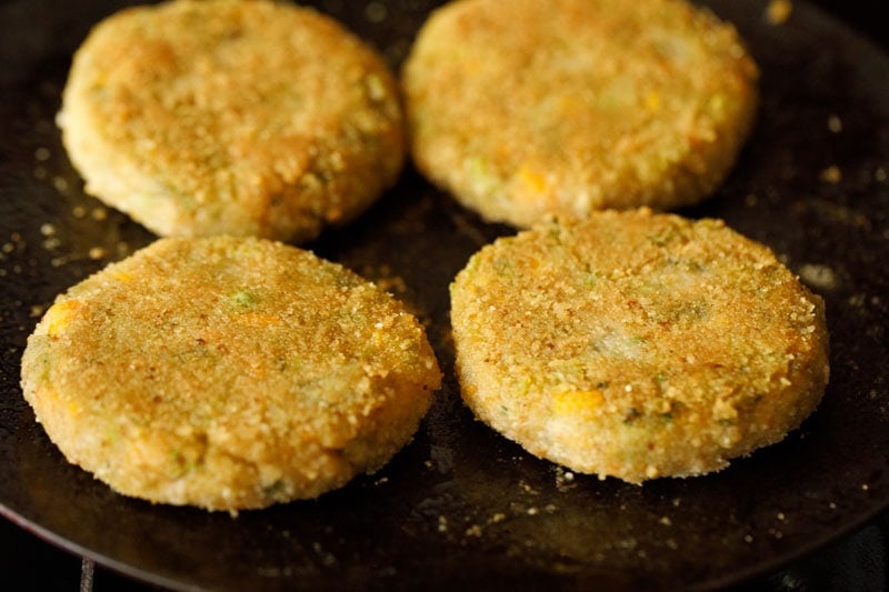 lightly golden pan fried cutlet on skillet