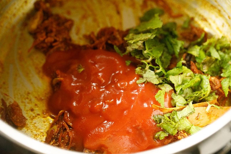 tomato paste and mint added to pan