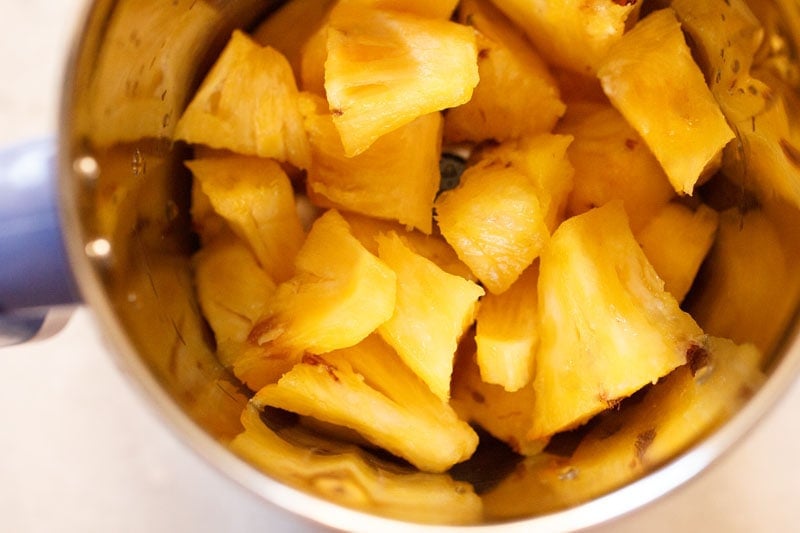 chopped pineapple in a blender jar