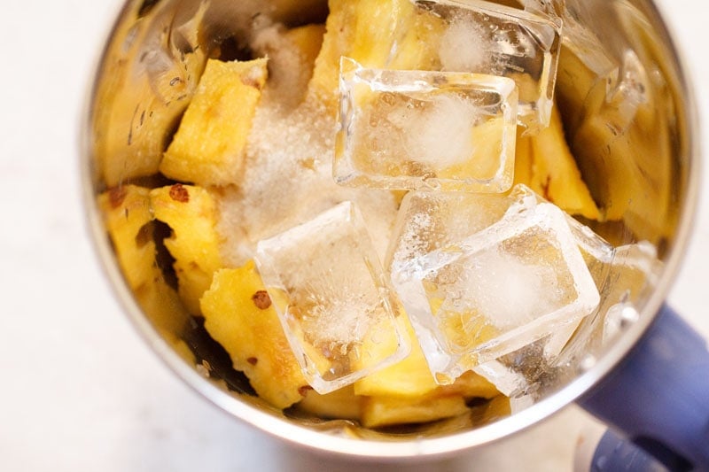 water, sugar and ice added to blender jar