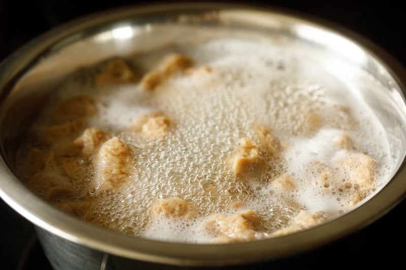boiling soya chunks to prepare them for making biryani