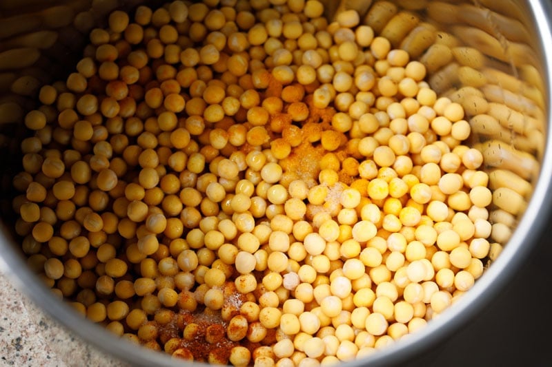 dried white peas added to instant pot with spices