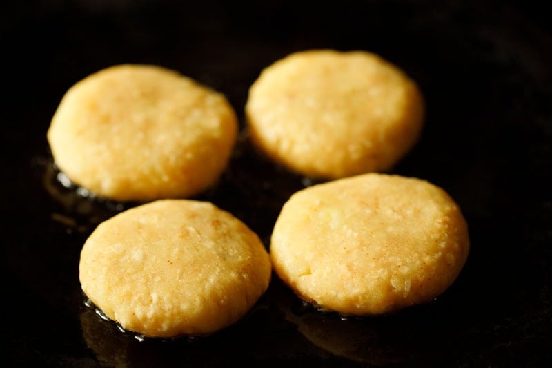 place potato patties on a skillet for frying