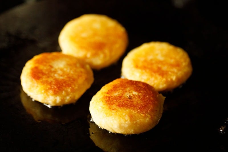 frying potato patties in the skillet