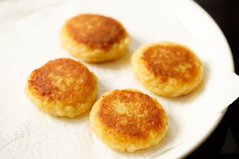 pan-fried potato patties on kitchen paper towels