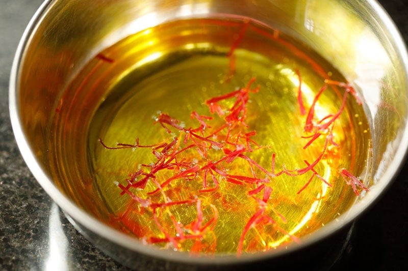 saffron threads infusing water