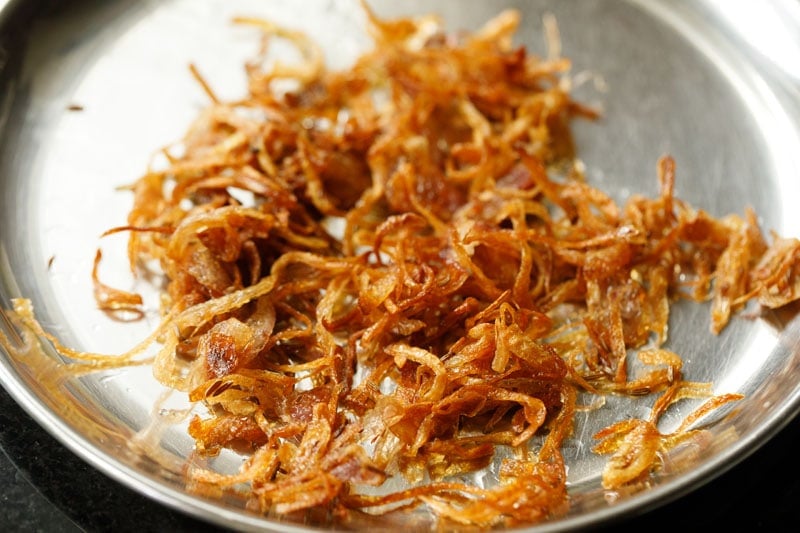 half the fried onions in the pan