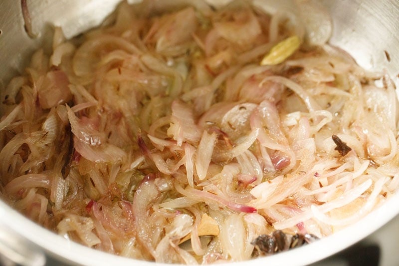 phase of onions becoming caramelized  for making meal maker biryani. 