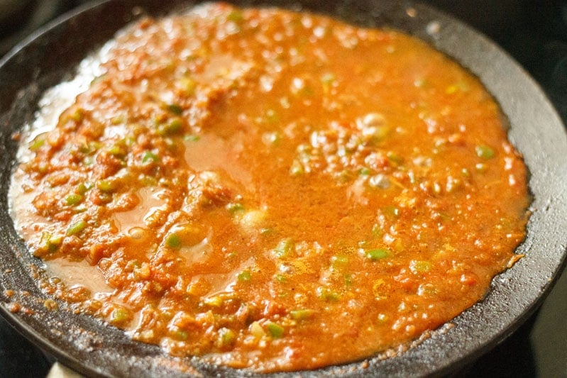 salt and tomato puree mixture on tawa