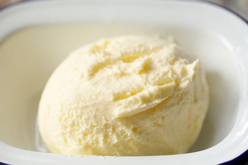 homemade butter placed in a ceramic crock