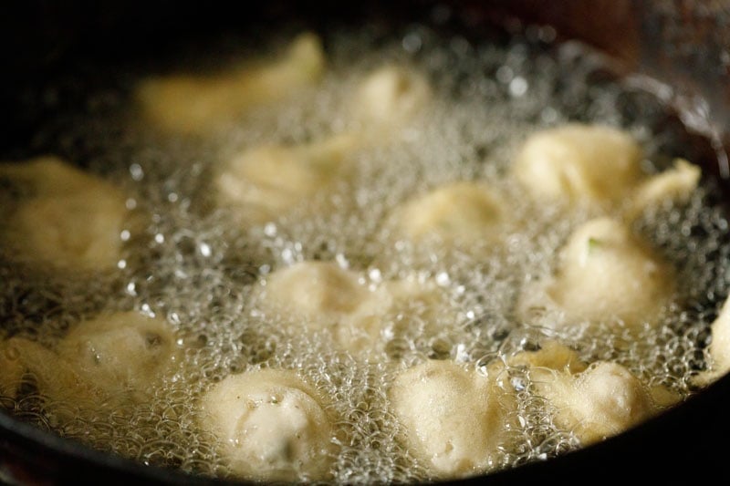 adding mysore bonda batter to hot oil