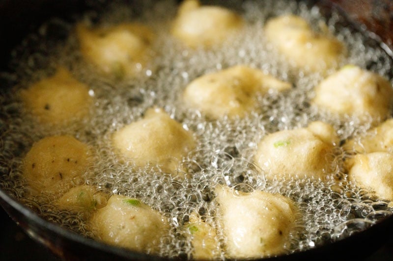 frying mysore bonda in hot oil