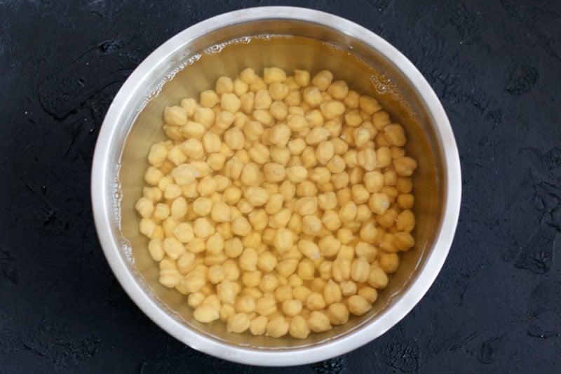 soaked chickpeas in water in a bowl
