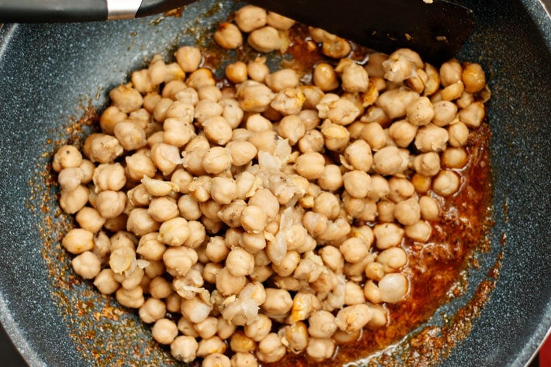 cooked chickpeas added to masala