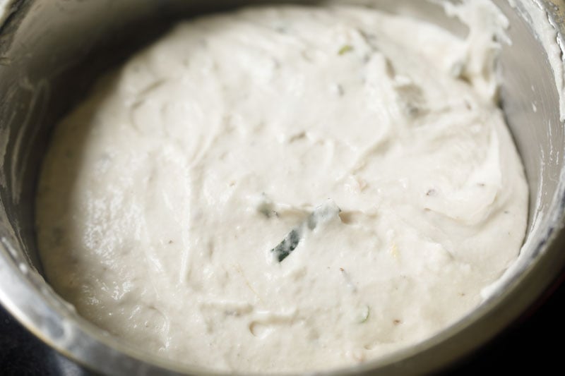 spices and herbs mixed with the medu vada batter