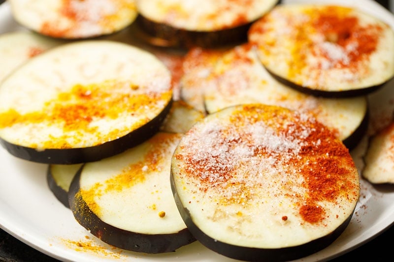 spices and salt on eggplant slices